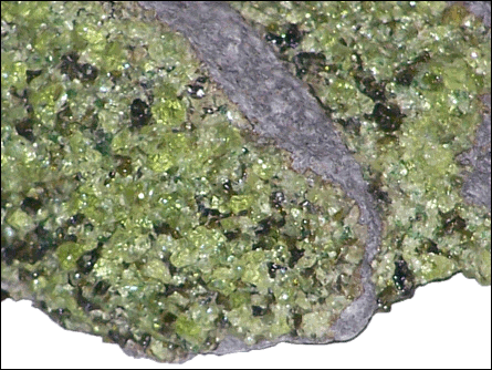 Peridot  green crystals in basalt